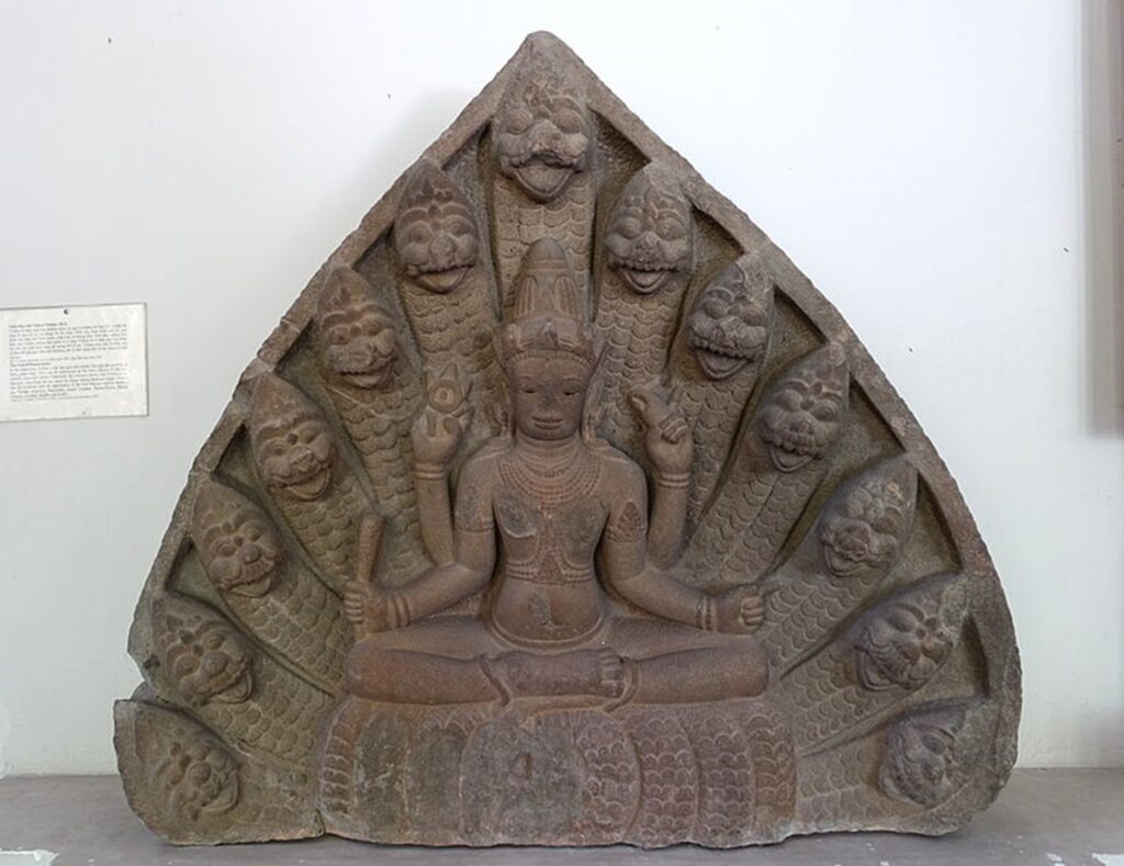 Hindu god Vishnu sits on Shesha a multi-headed serpent god who serves as his throne